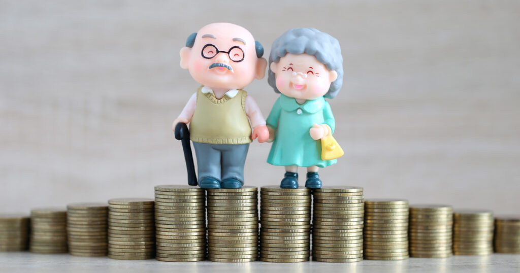 Kuvituskuva: eläkeläspariskunta ja rahaa